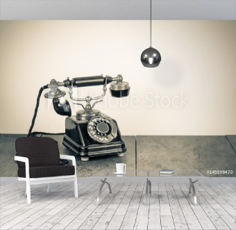 Picture of Vintage background with old rotary telephone on wood table